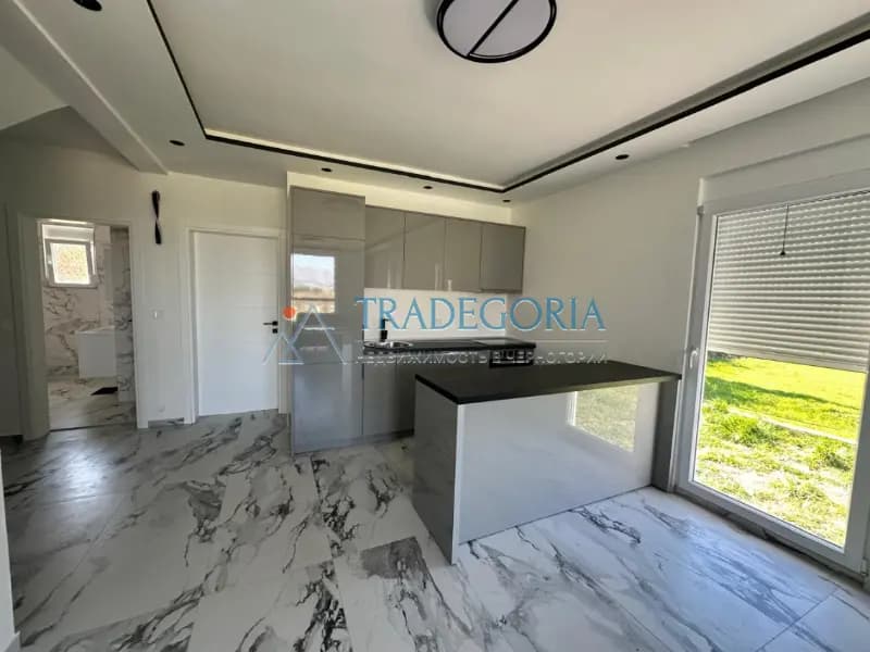 New spacious apartment in Tomba, Bar with 1 bedroom, garage, and a small plot.